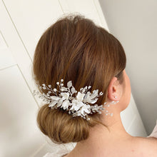 Load image into Gallery viewer, bride on wedding day wearing porcelain flower hair comb  
