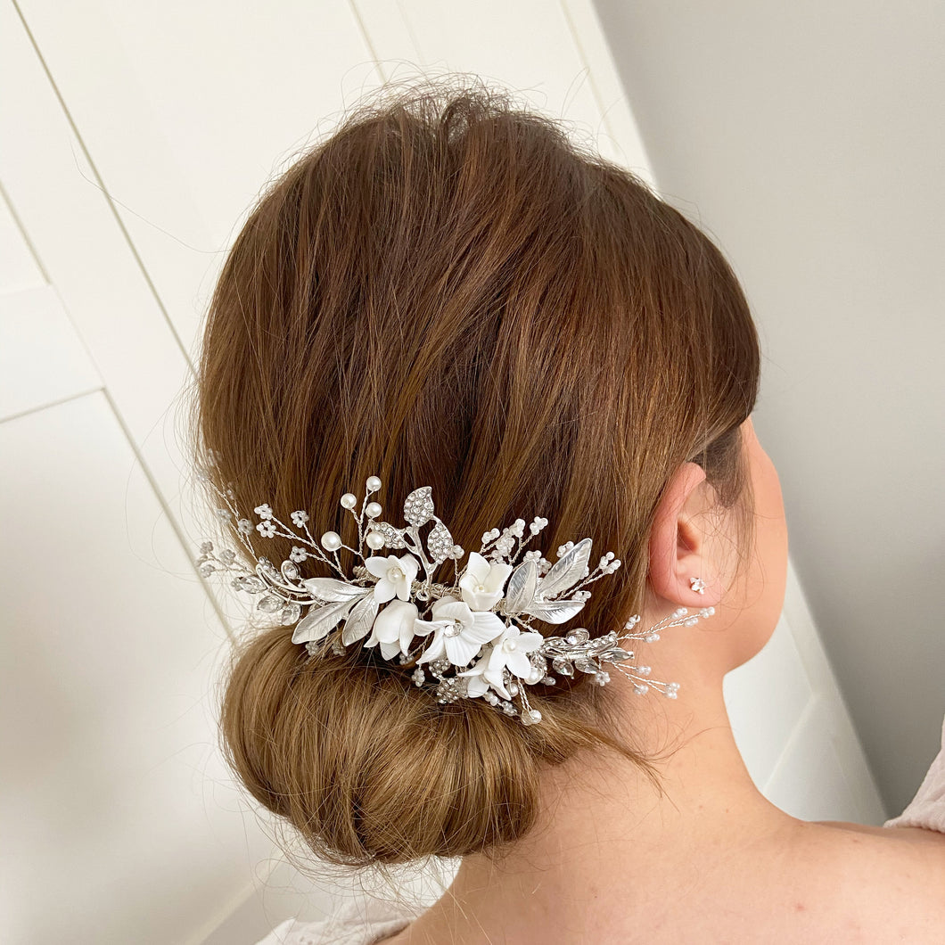 bride on wedding day wearing porcelain flower hair comb  